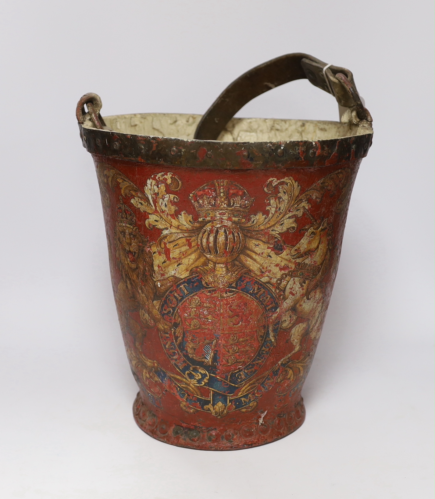 A 19th century red painted fire bucket decorated with royal crest, 32cm